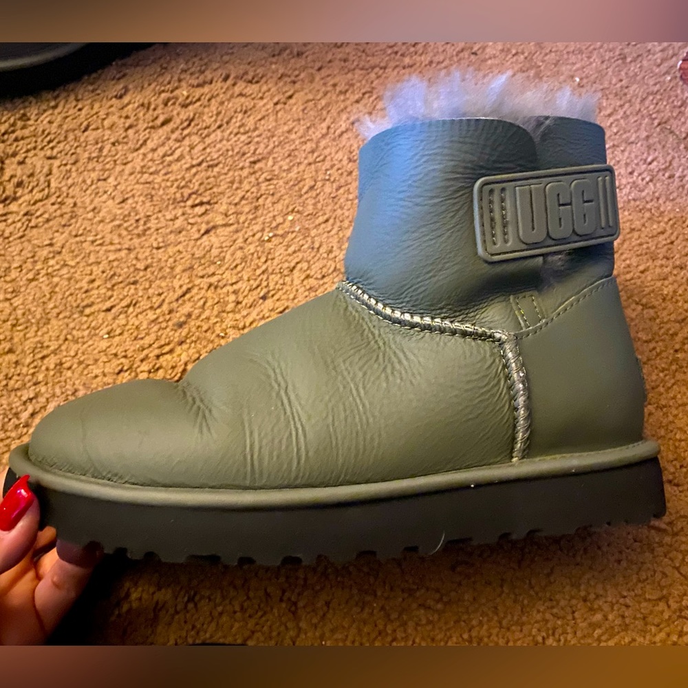 Short Ugg boots. Green in color. Velcro close with Ugg logo.